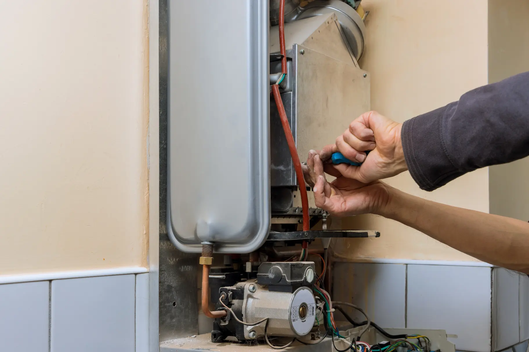HVAC technician inspecting residential furnace